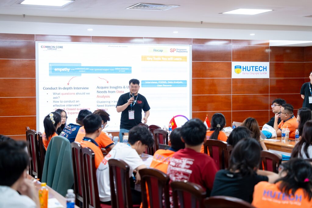 Jonathan Seet facilitating a group lesson for students in a classroom